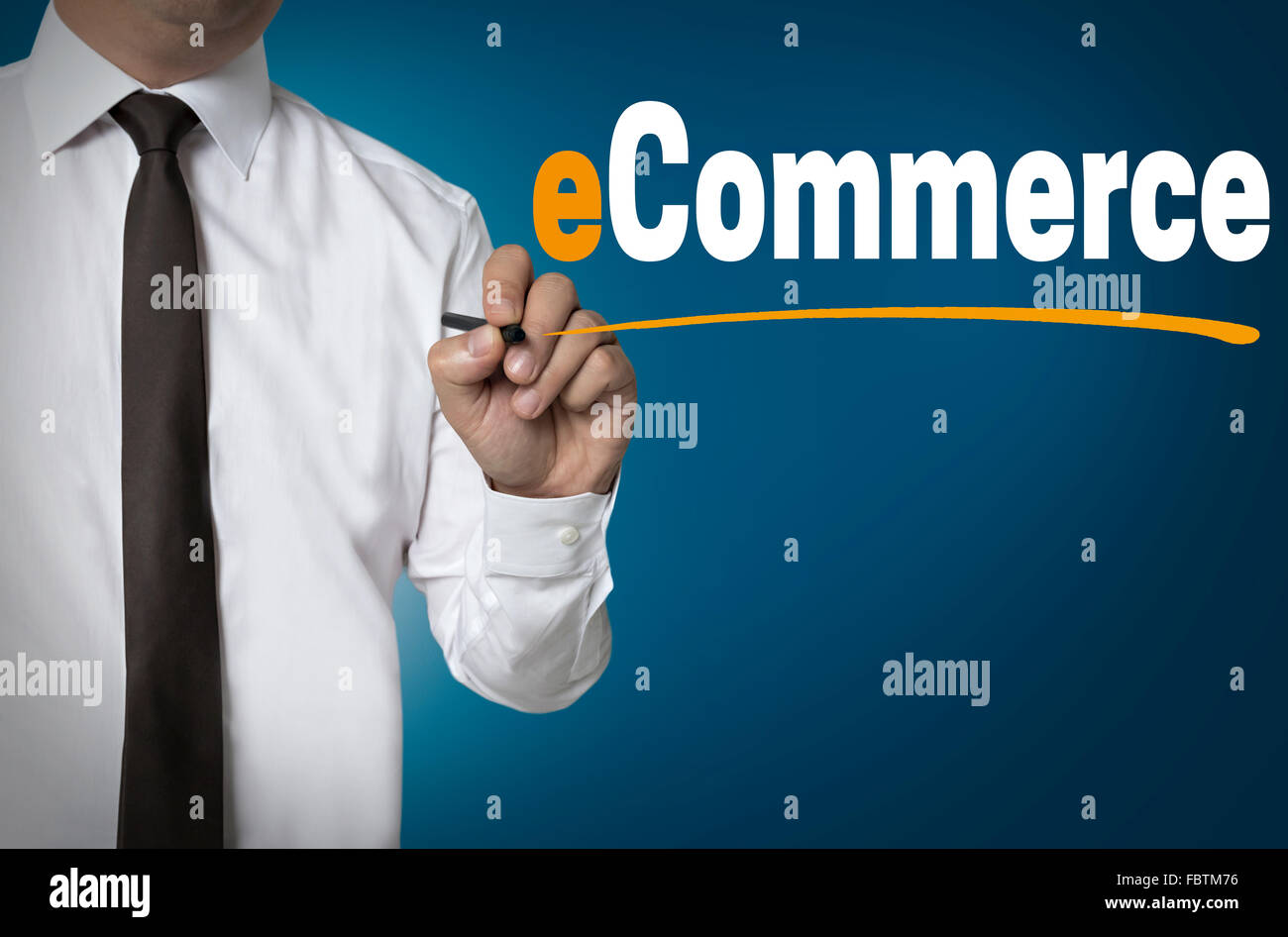e commerce is written by businessman background concept. Stock Photo