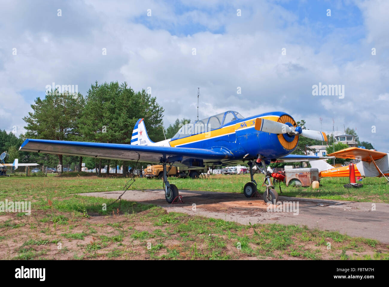 Yak-52 stands on the flight lane Stock Photo