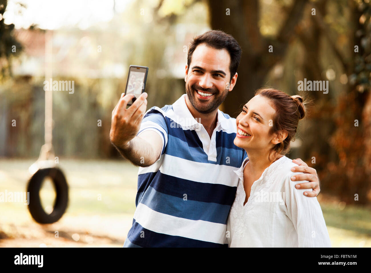 Couple posing for selfie Stock Photo
