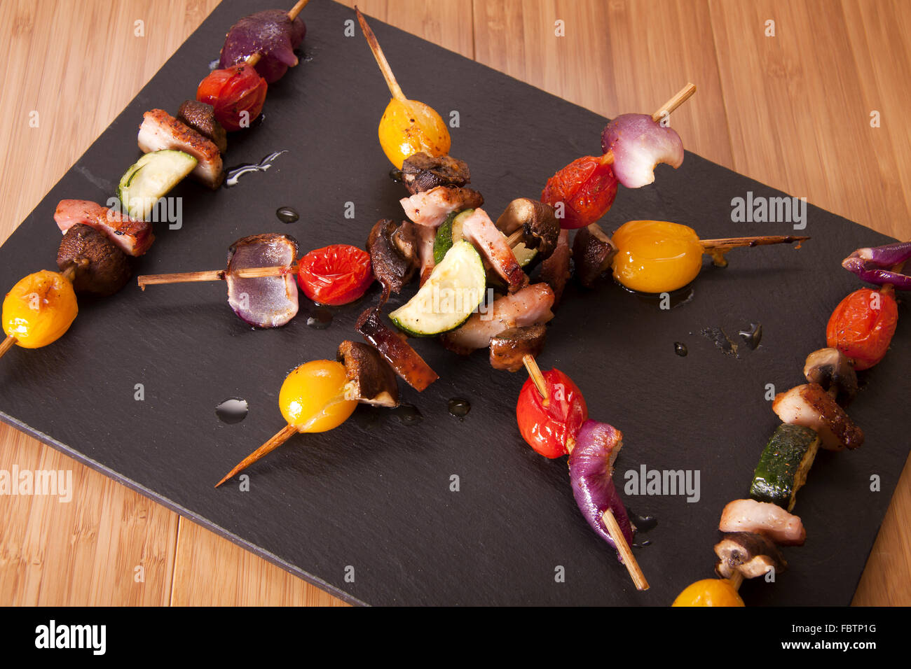 Vegetable and pancetta skewers Stock Photo Alamy