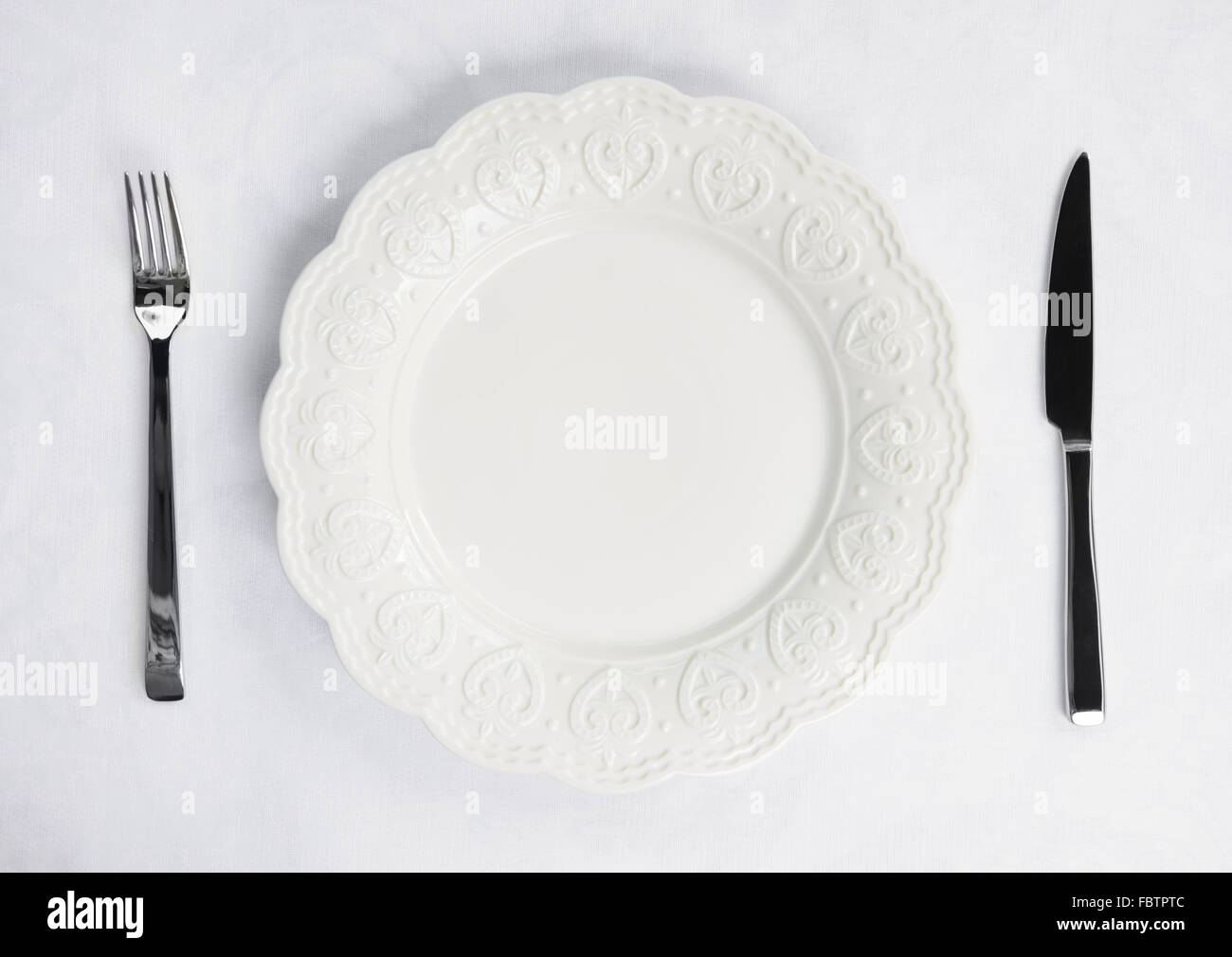 Place setting with plate, knife and fork Stock Photo Alamy