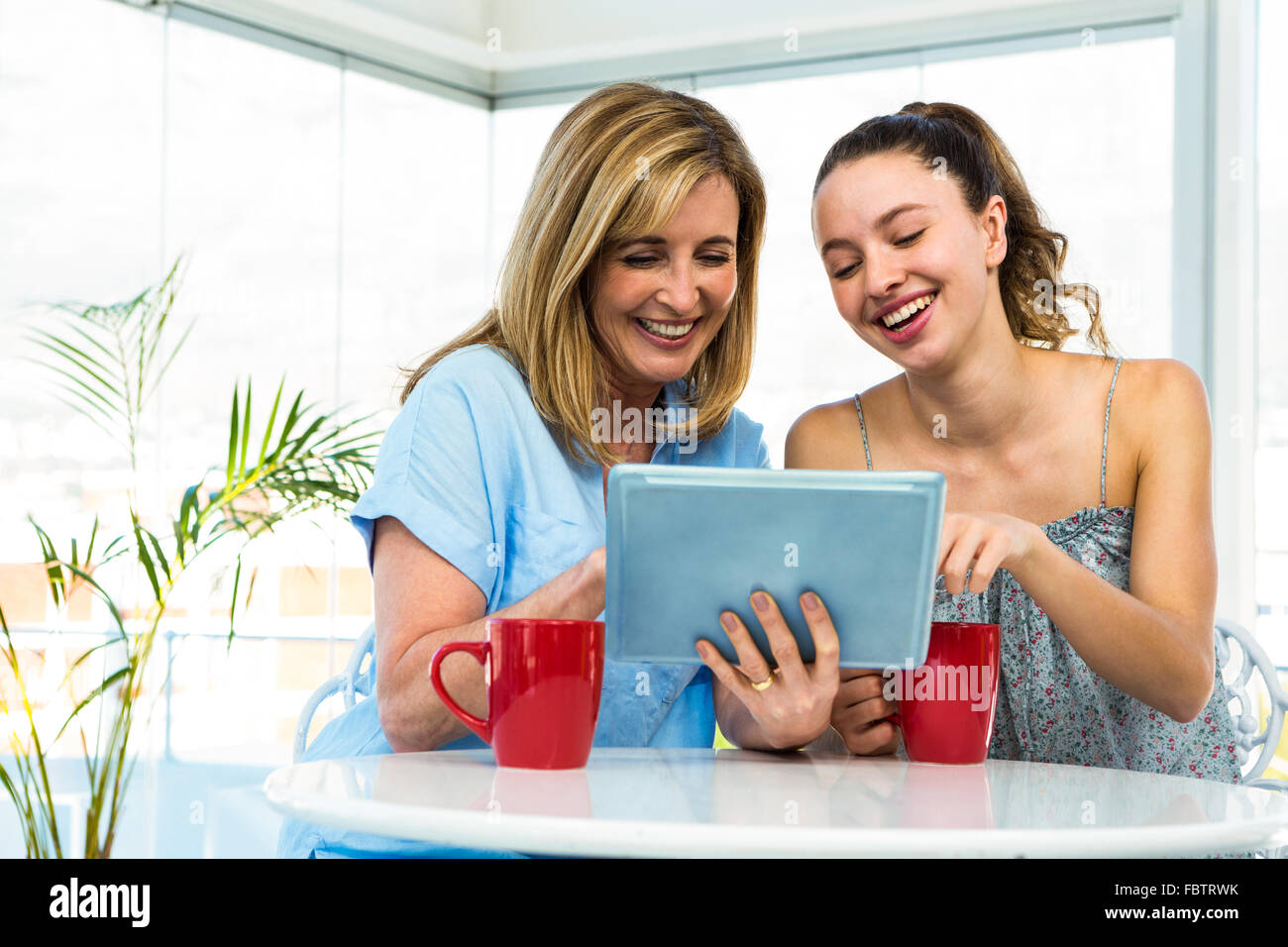 Mother and daughter watch tablet Stock Photo