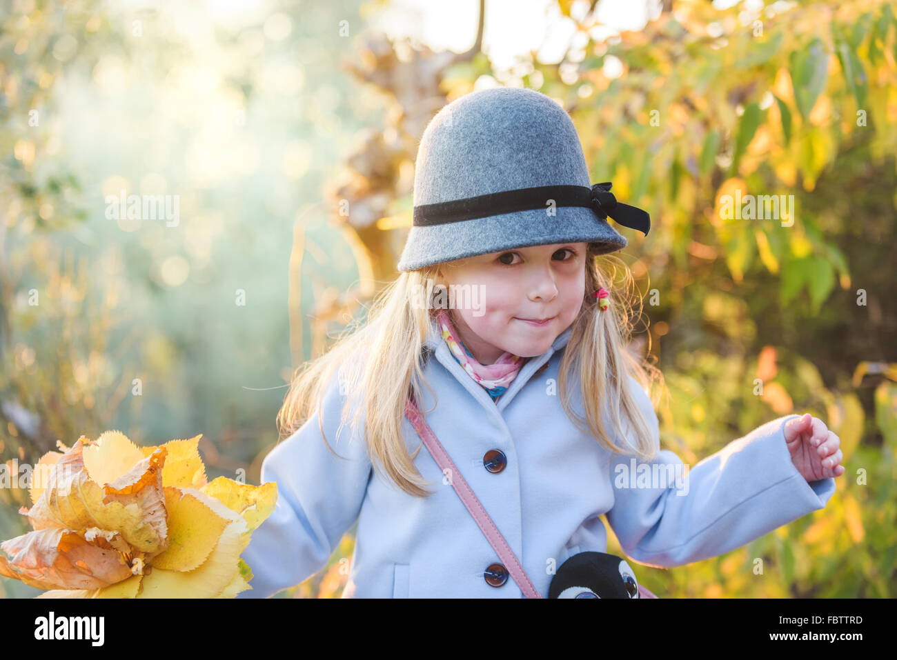 Young happy smiling girl in autumn day Stock Photo - Alamy