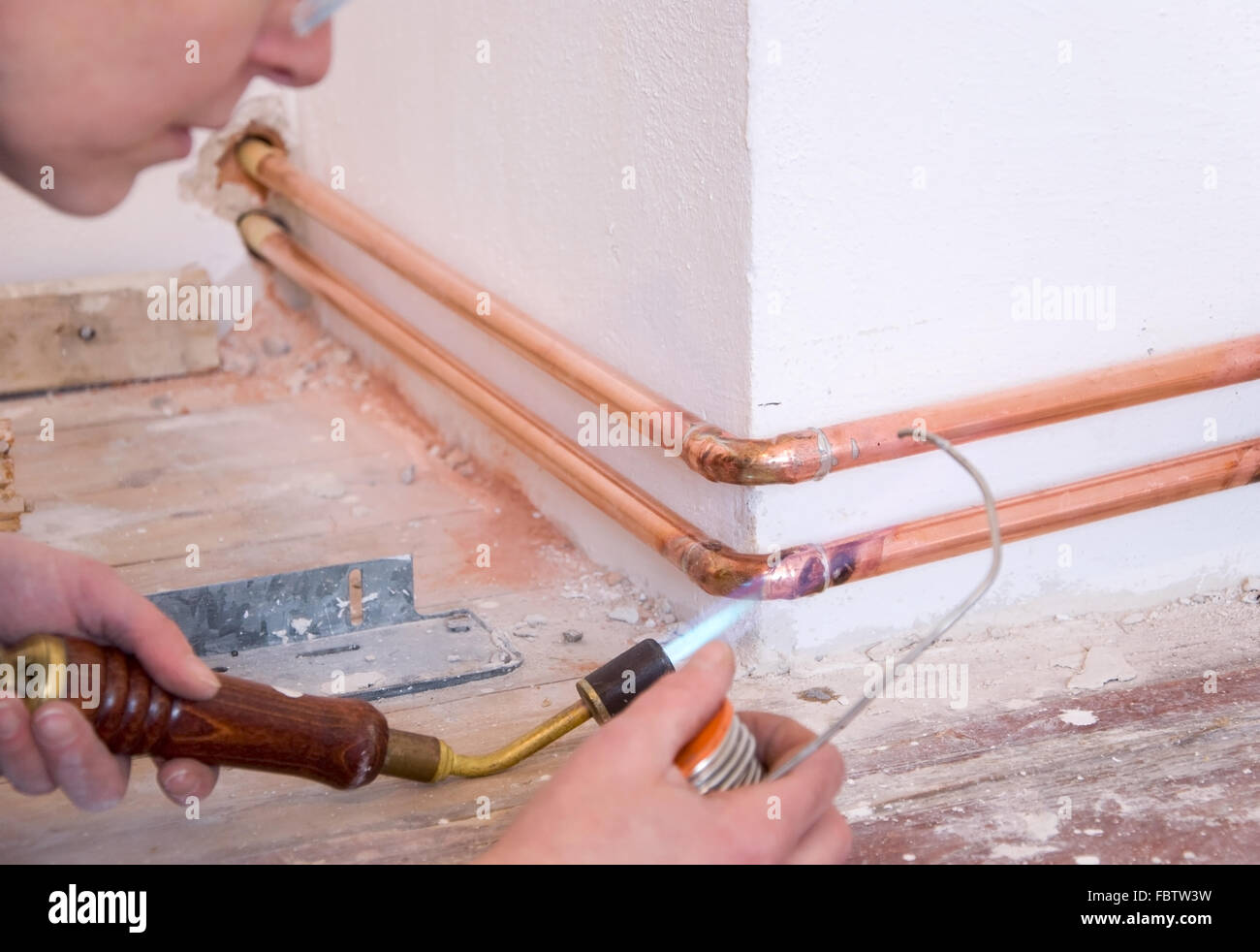plumber and soldering gun Stock Photo