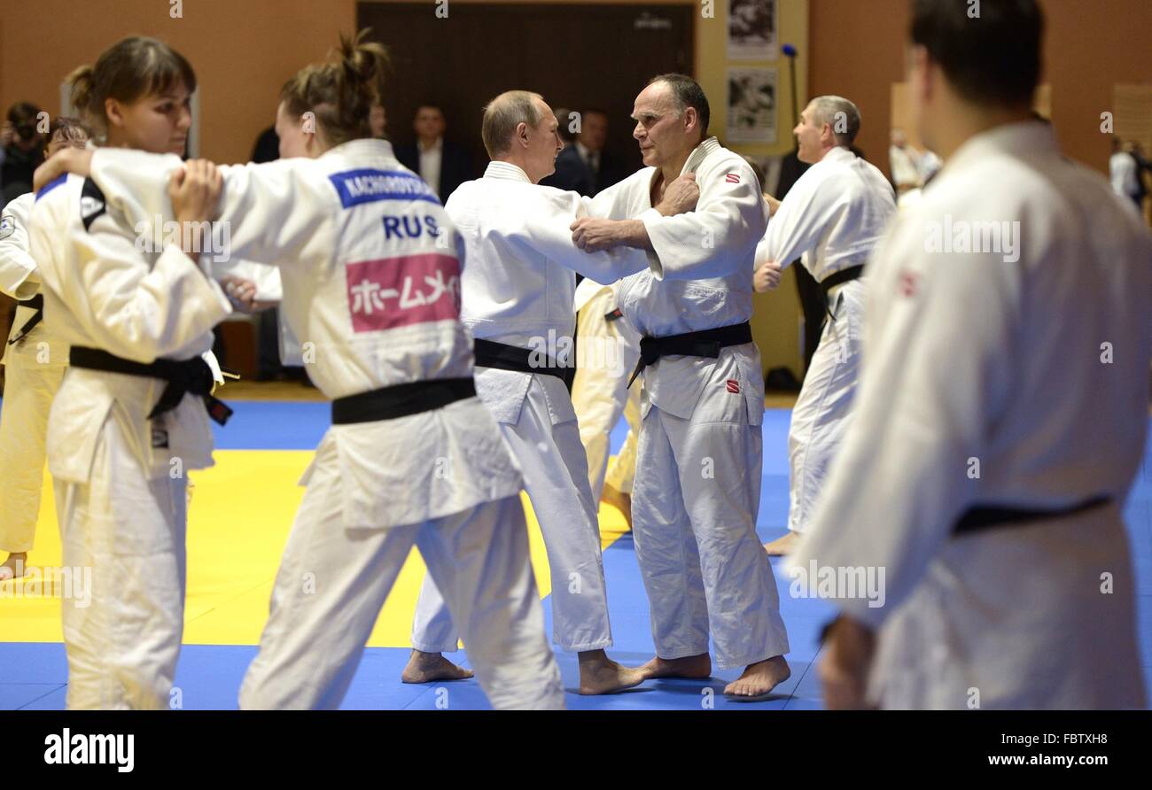 Russian President Vladimir Putin spars with Russian national judo team coach Ezio Gamba during a training session with Russian athletes January 8, 2016 in Sochi, Russia. Stock Photo