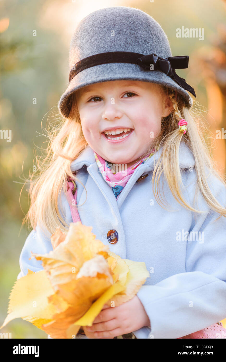 Young smiling girl in autumn day Stock Photo - Alamy