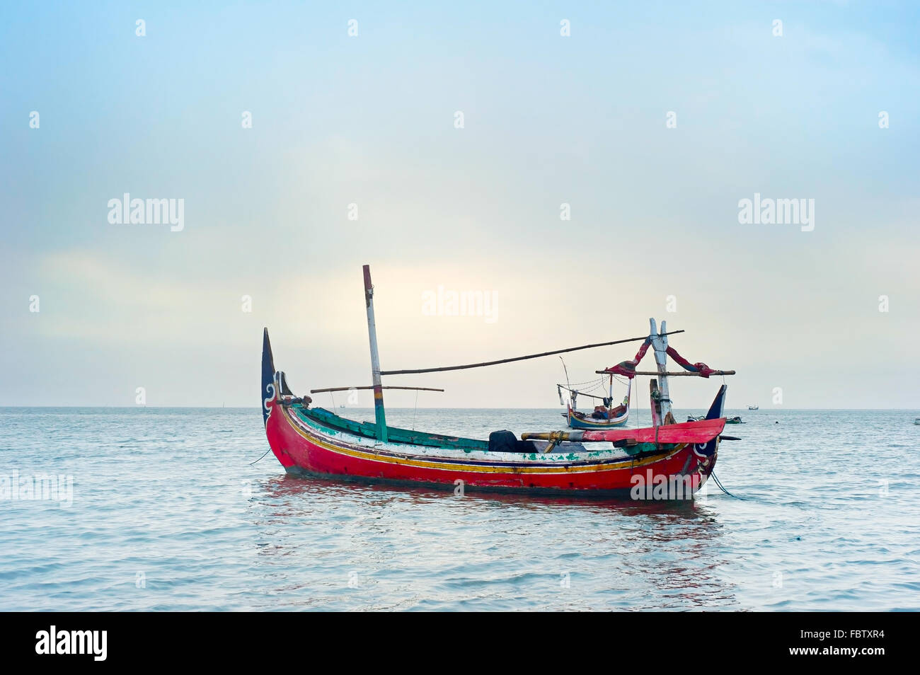 Traditional Indonesian fishing boats in the ocean, Java island, Indonesia Stock Photo