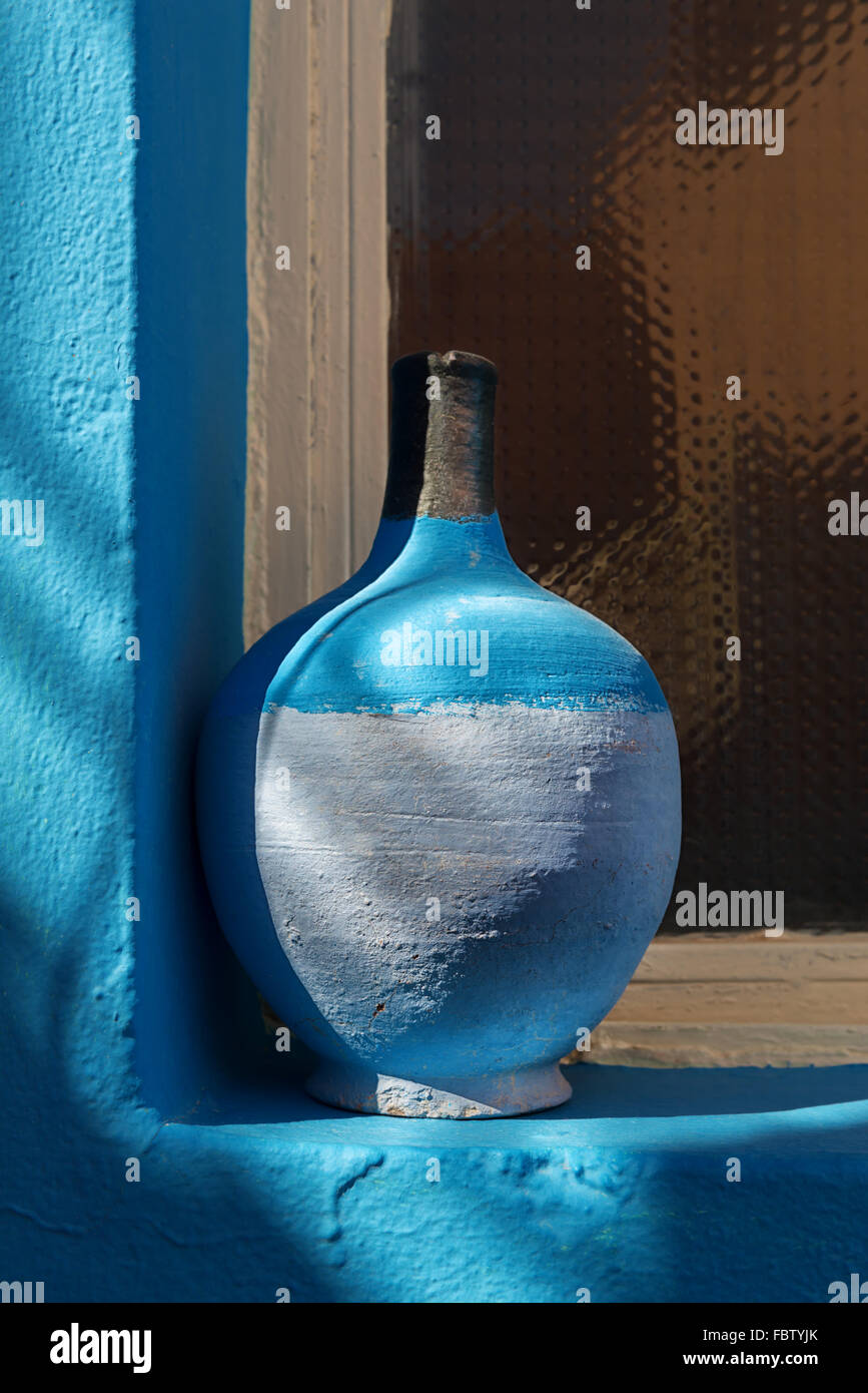 Still Life - Blue pottery on window sill. Stock Photo