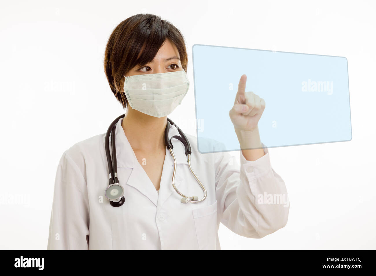 Chinese female doctor with stethoscope pressing virtual interface Stock Photo