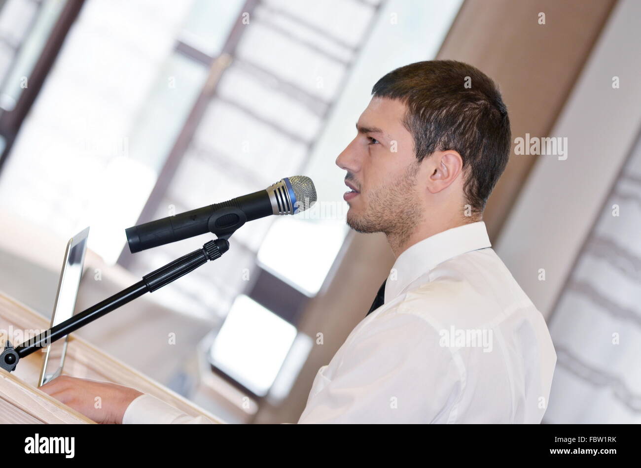 Young business man giving a presentation on conference Stock Photo - Alamy