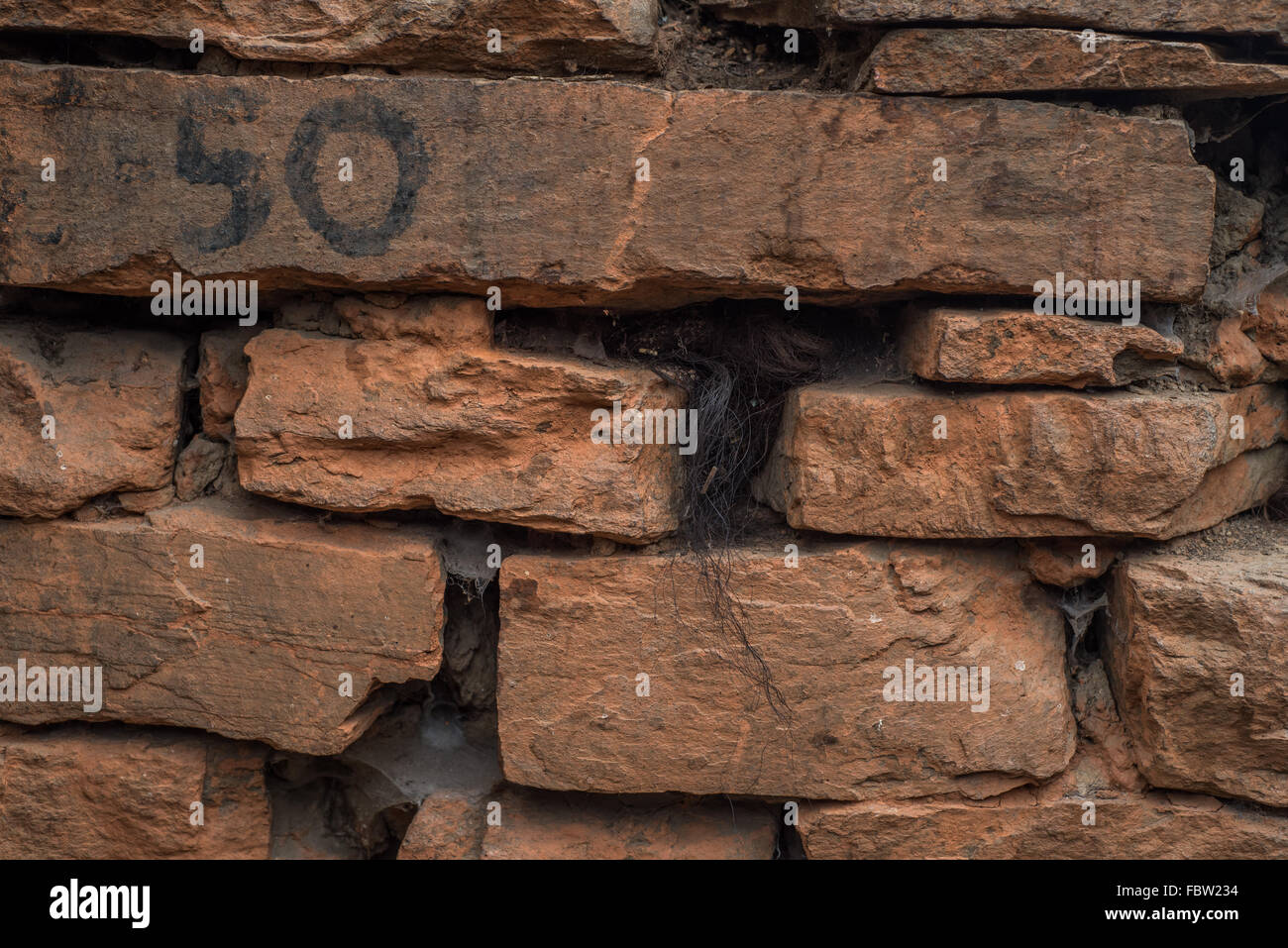 Unfinished brick wall stacked hi-res stock photography and images - Alamy