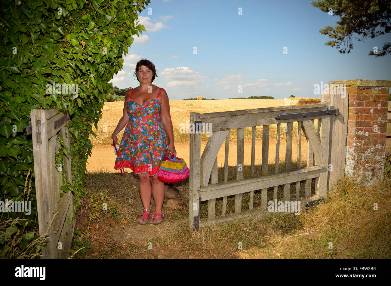 Lady in lovely sunlight, Ramsholt Church, Ramsholt, Suffolk. Stock Photo