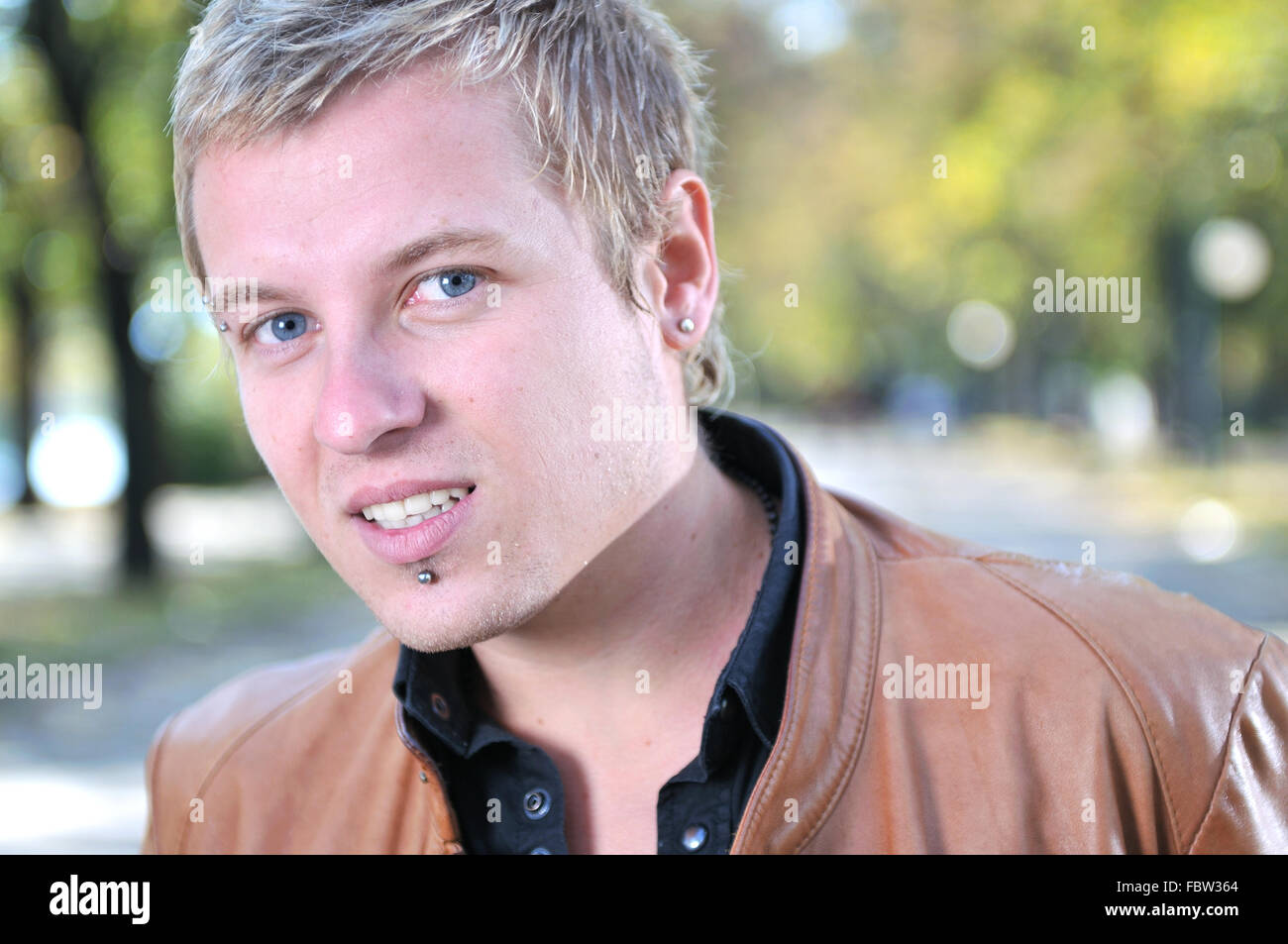 happy young casual man outdoor portrait smiling Stock Photo - Alamy