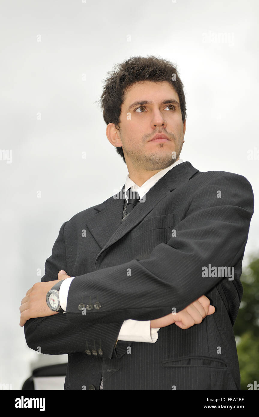 Outdoor portrait of young and happy businessman Stock Photo - Alamy
