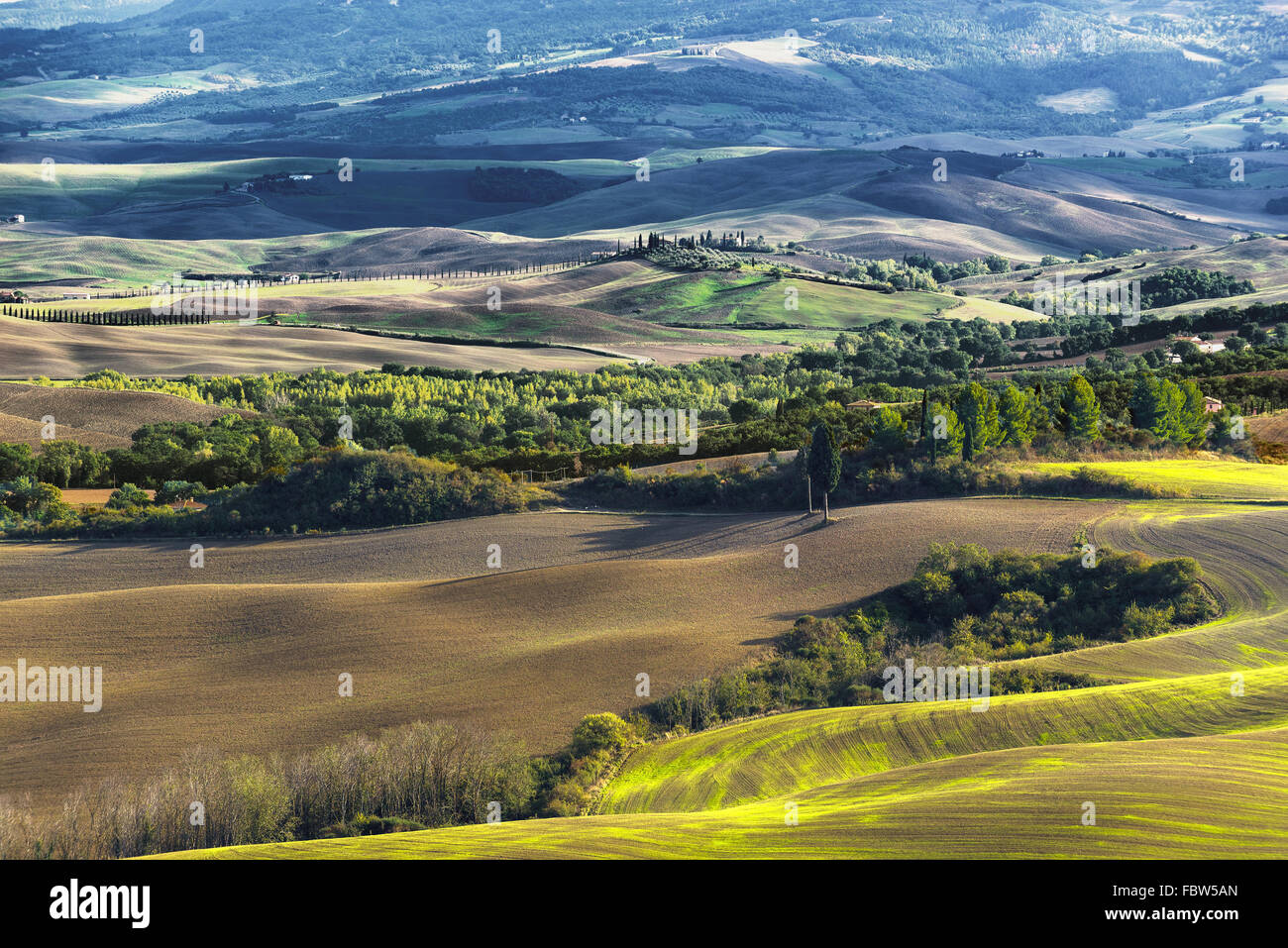 Plowed fields in the picturesque landscape of Italy. Tuscany landscape. Stock Photo