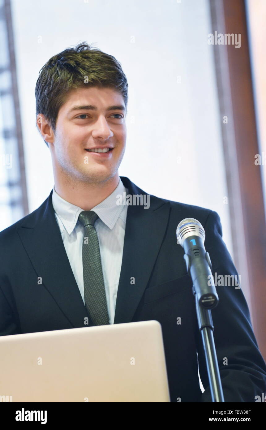 Young business man giving a presentation on conference Stock Photo - Alamy