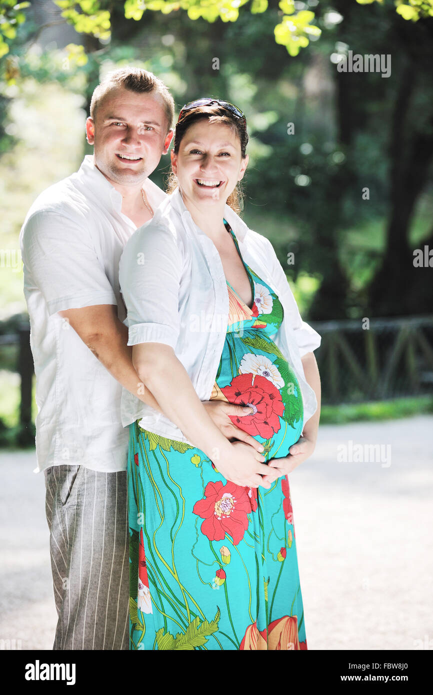 Happy pregnant couple at beautiful sunny day in park Stock Photo - Alamy