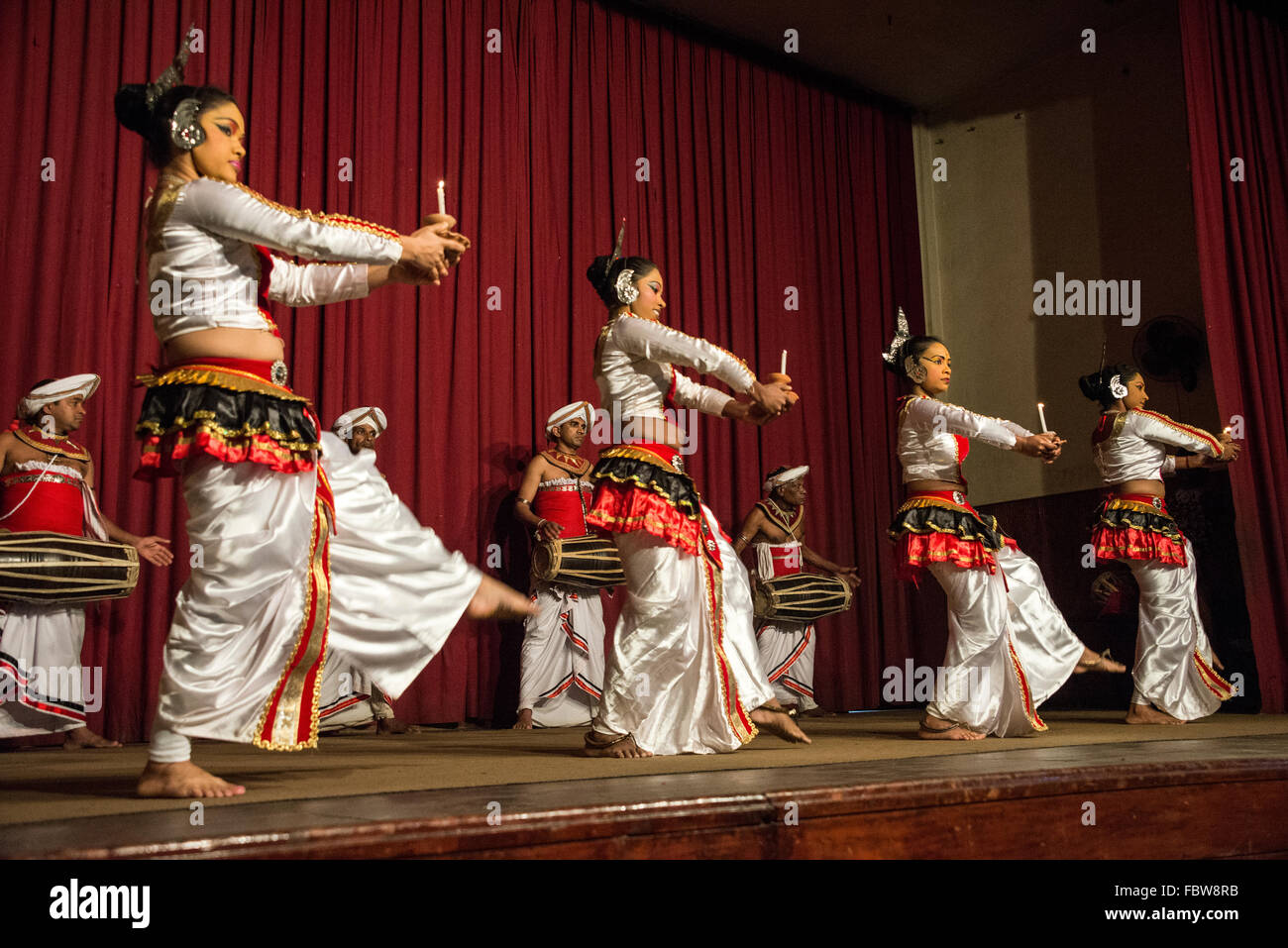 A group of Kandyan dancers performing the Pooja dance with the Kandyan drummers part of the Kandyan dance in Ksndy, Sri Lanka Stock Photo