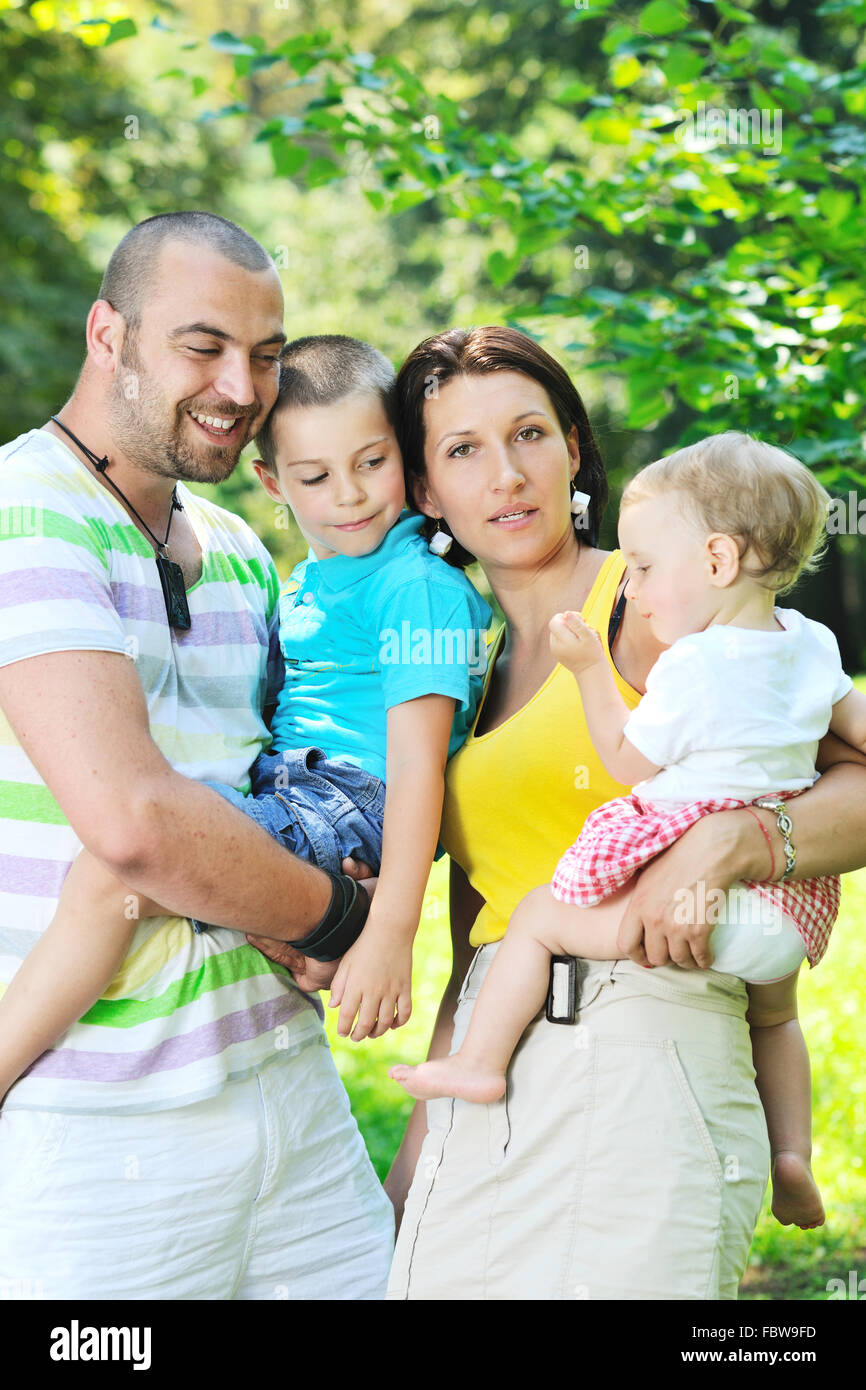 happy young couple with their children have fun at park Stock Photo - Alamy