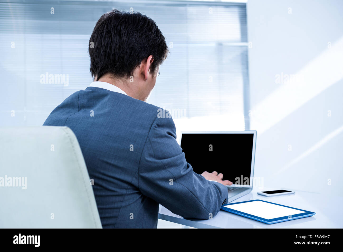 Businessman using his computer Stock Photo