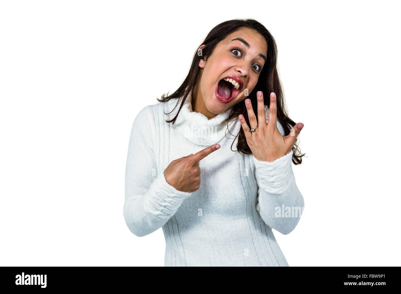Cheerful young woman showing ring Stock Photo - Alamy