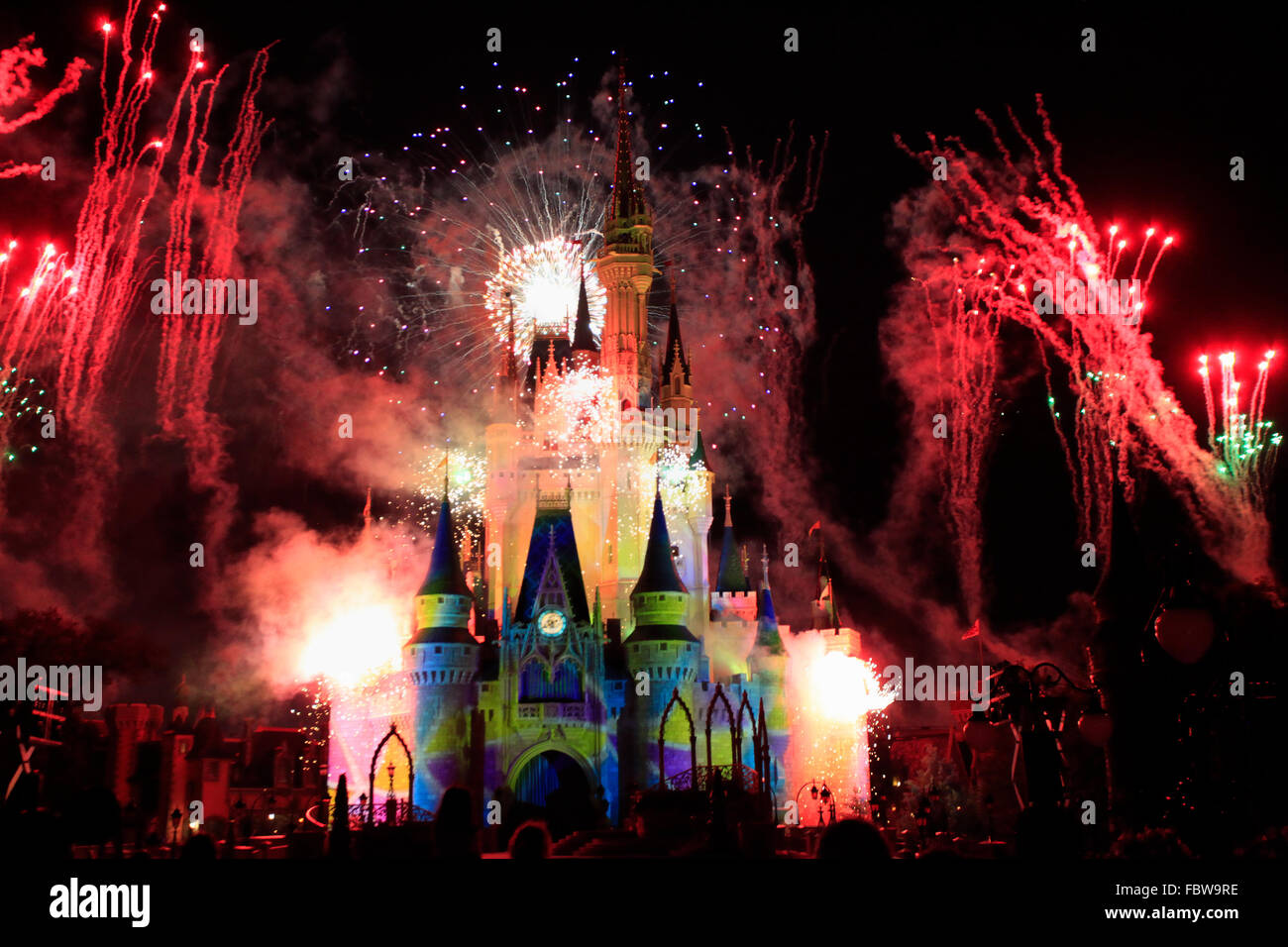 Cinderella Castle illuminated at night and fireworks, Magic Kingdom, Disney Stock Photo