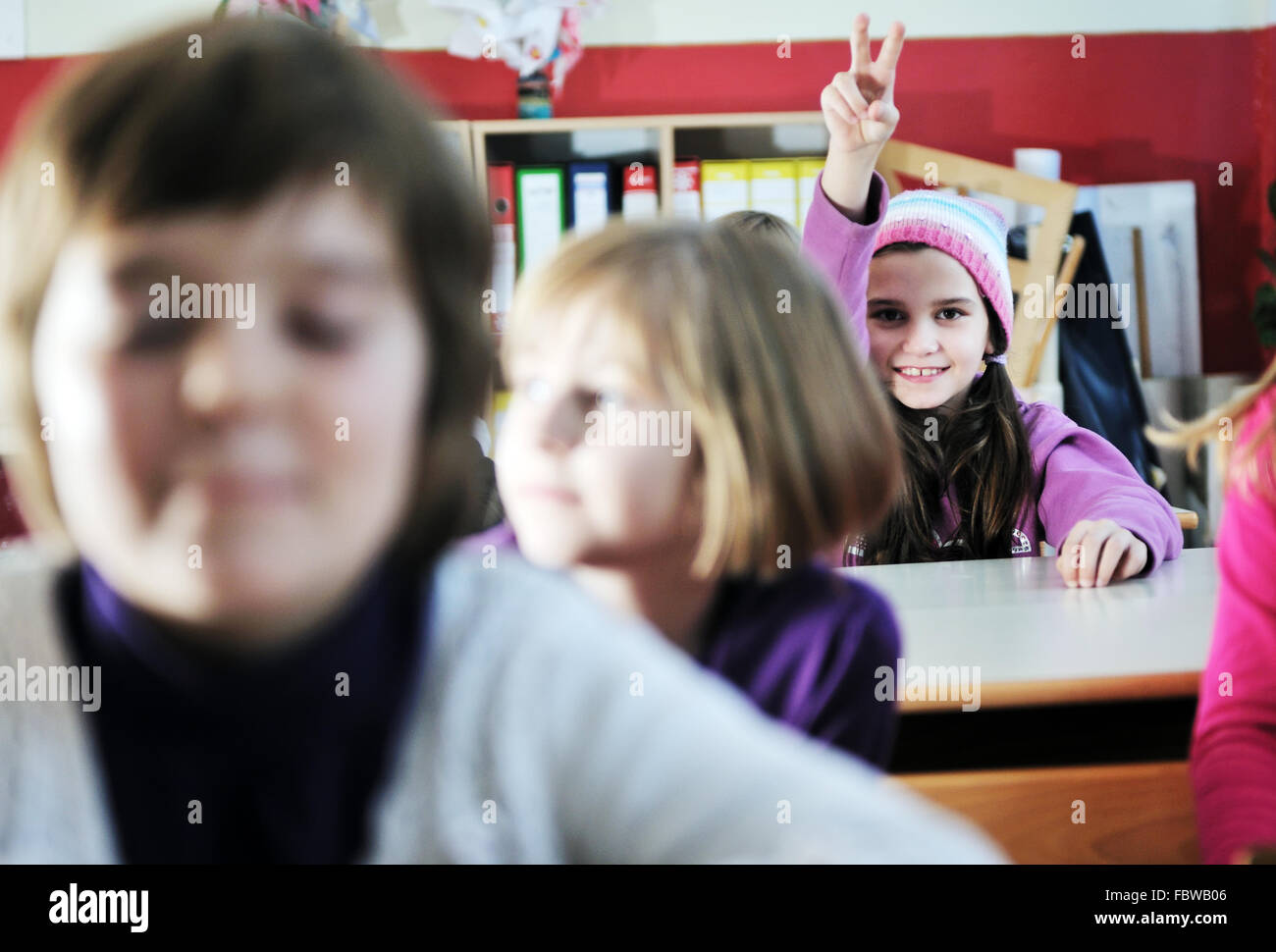 happy kids with teacher in school classroom Stock Photo - Alamy