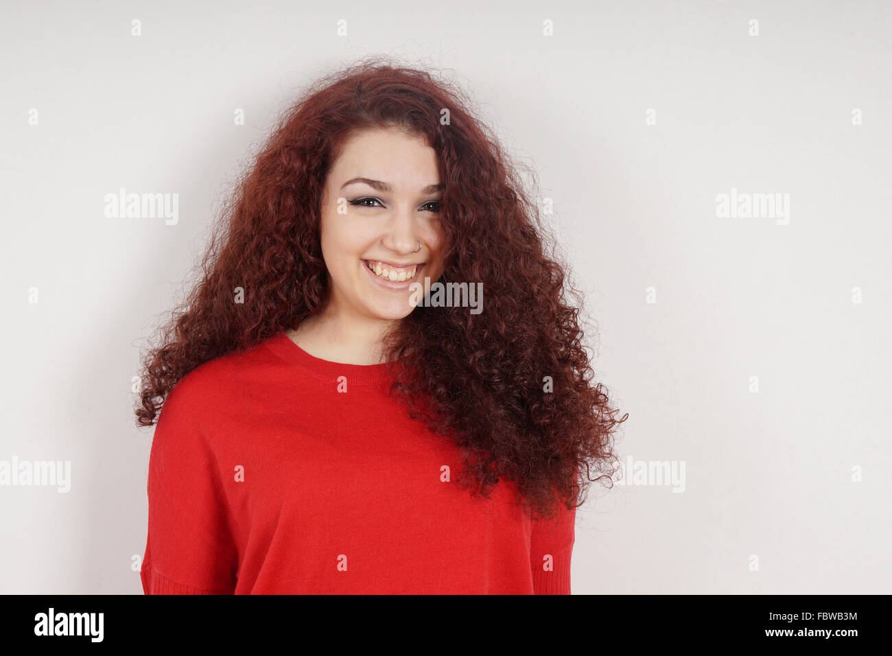 young woman with a toothy smile Stock Photo - Alamy