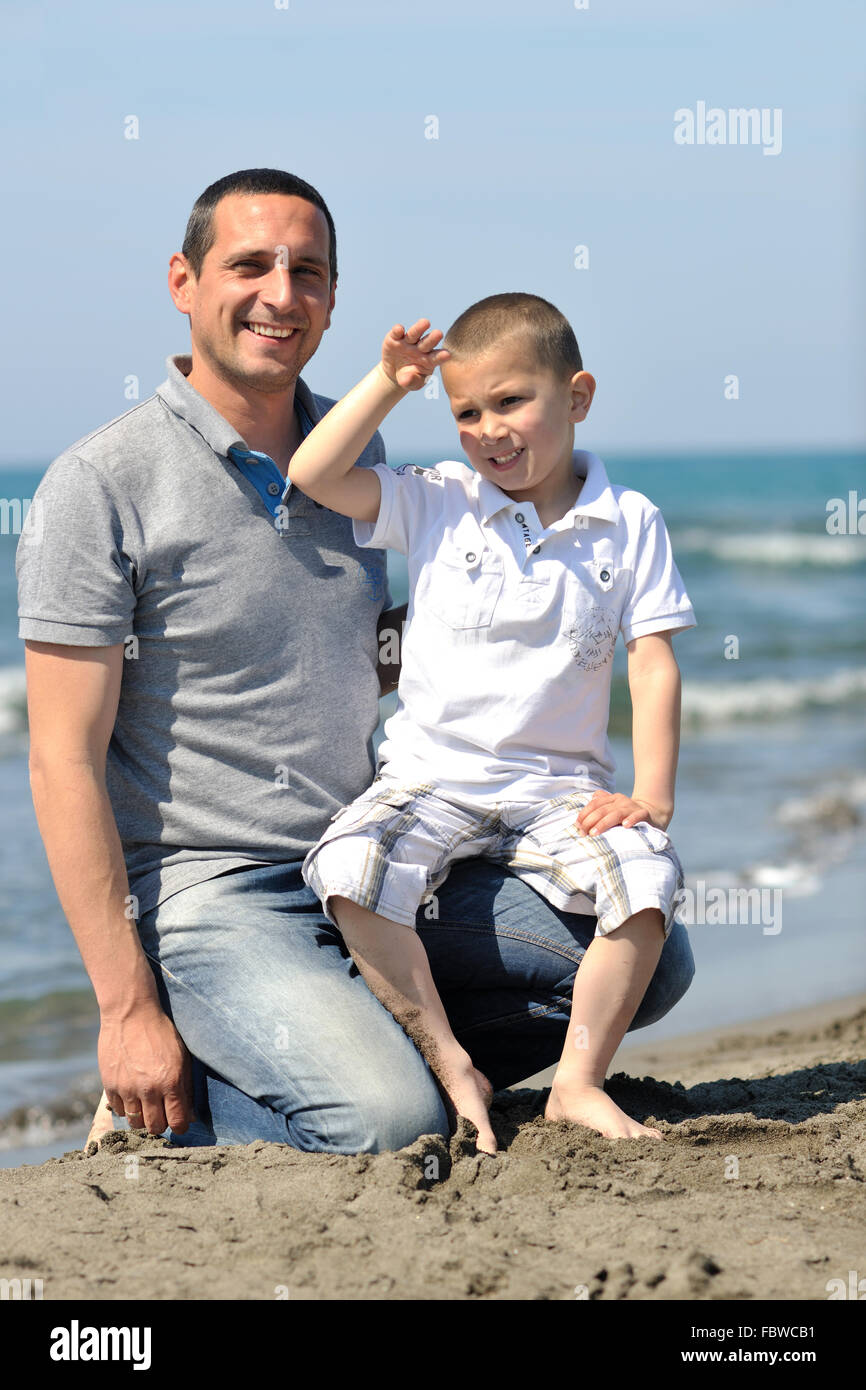 happy father and son have fun and enjoy time on beach Stock Photo - Alamy