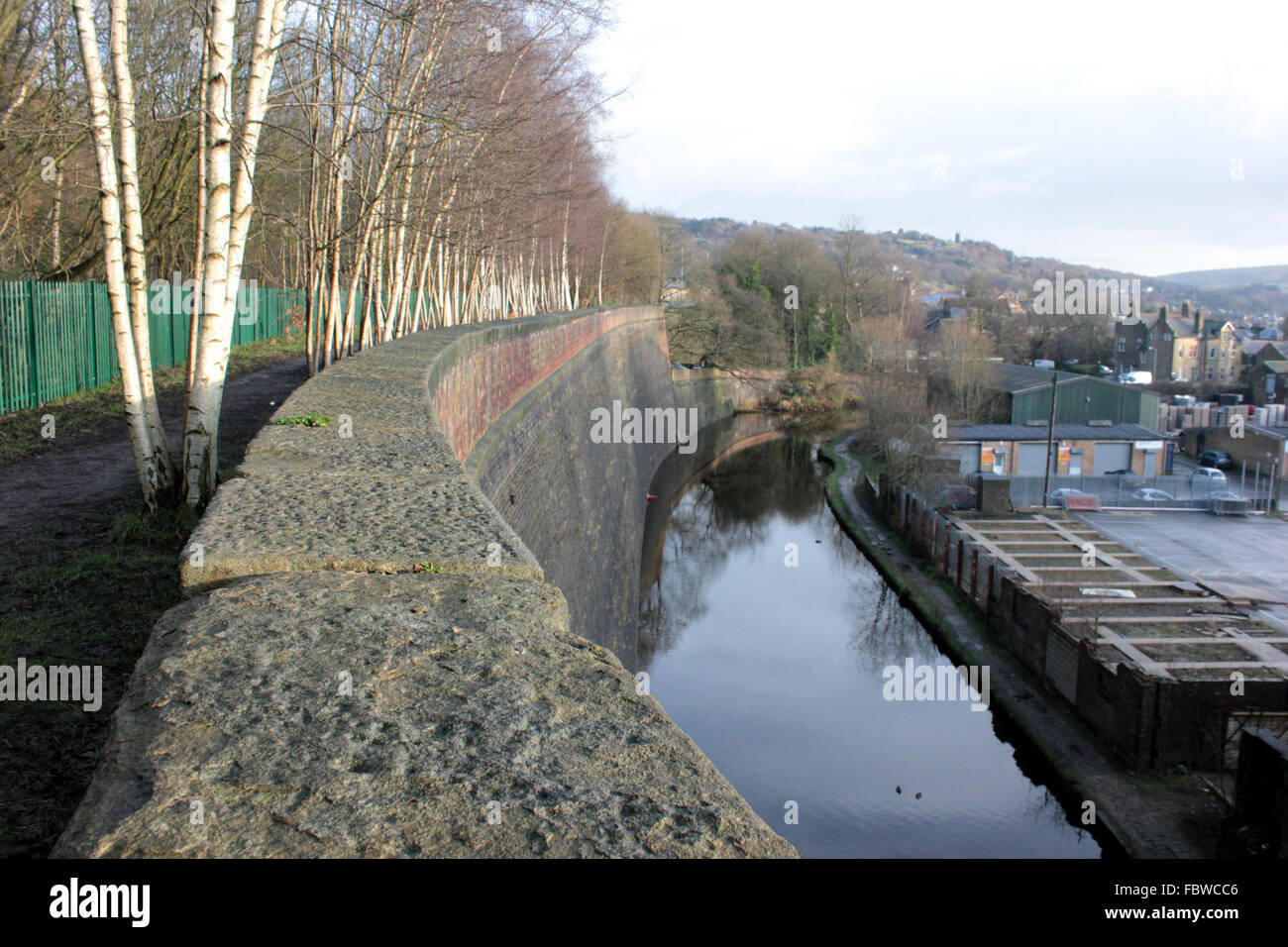 The Great Wall of Todmorden.  The massive brick wall towering alongside the Rochdale canal on the Lancashire and Yorkshire border. Stock Photo