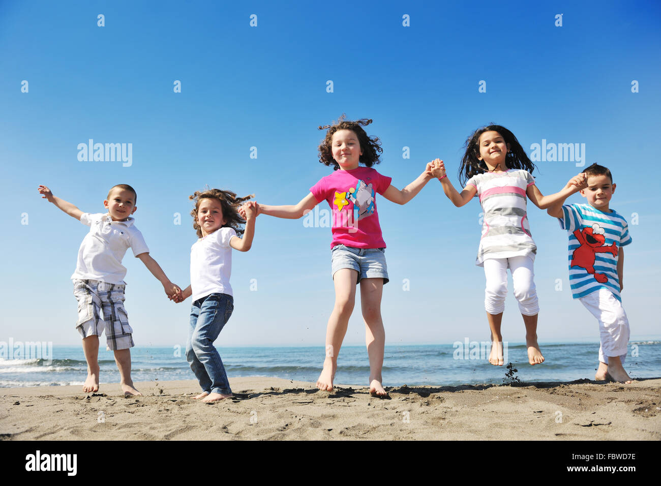 happy young people group have fun on beach Stock Photo - Alamy