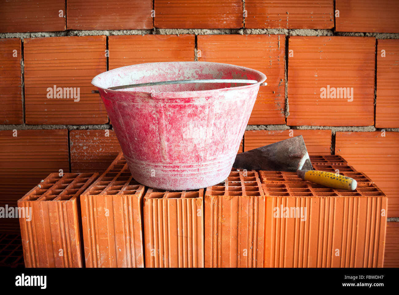 Trowel, bucket and bricks Stock Photo Alamy