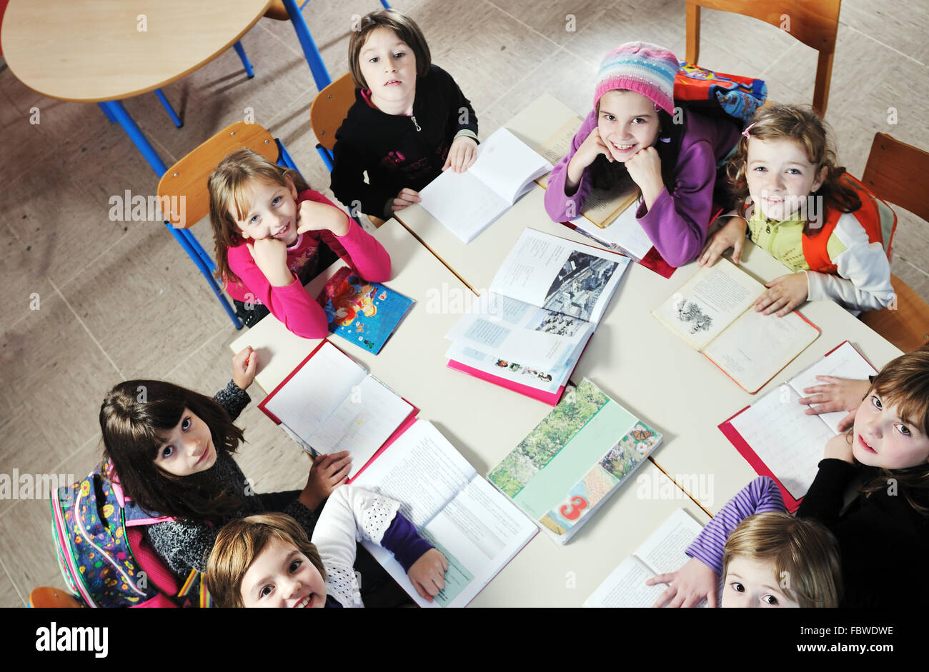 happy kids with teacher in school classroom Stock Photo - Alamy