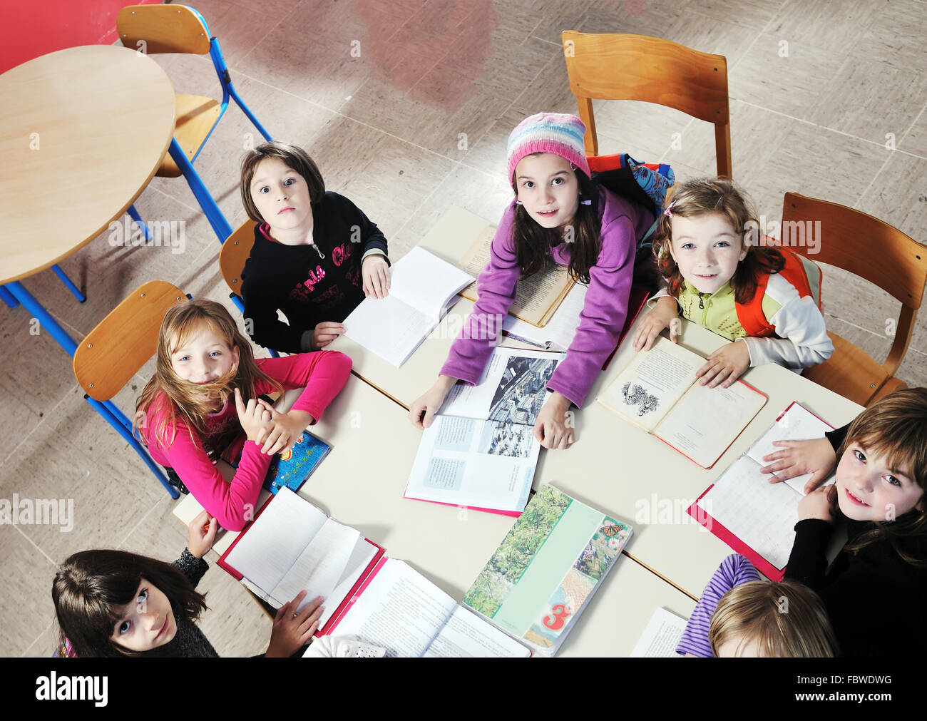happy kids with teacher in school classroom Stock Photo - Alamy