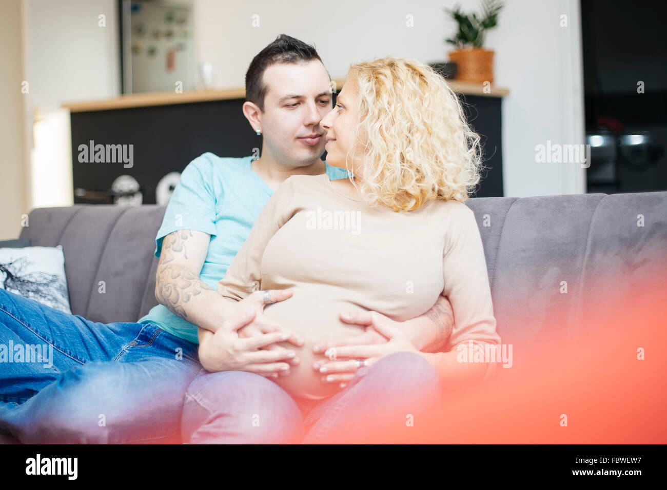 Young couple in the room expecting baby Stock Photo