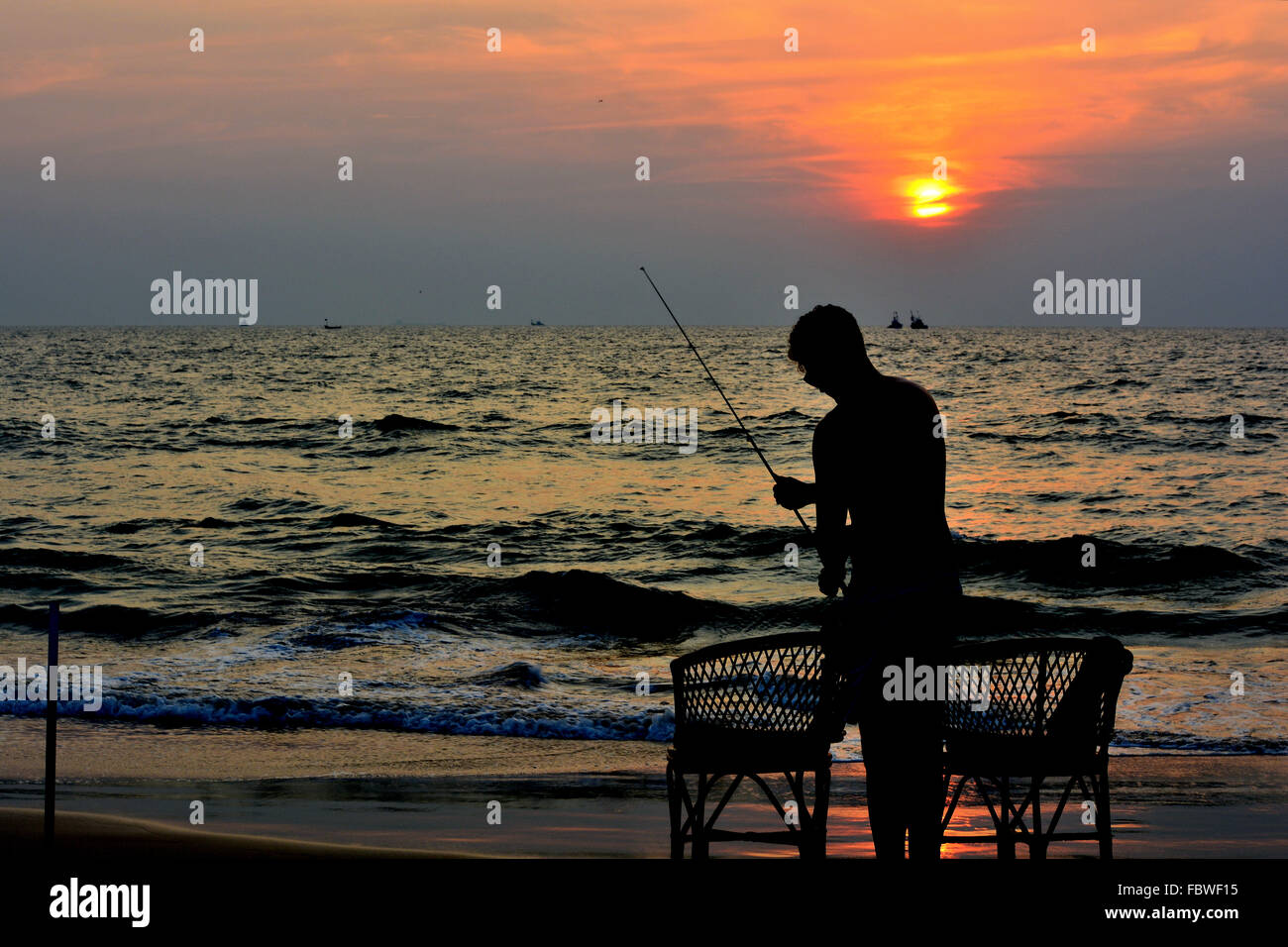 A man fishing in the evening Stock Photo