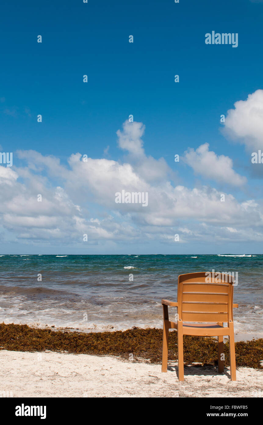 singular chair at the beach in Vieux Fort Stock Photo