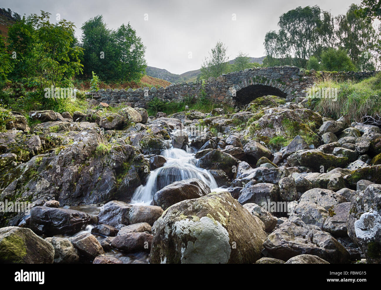 Ashness Bridge over small stream in Lake District Stock Photo