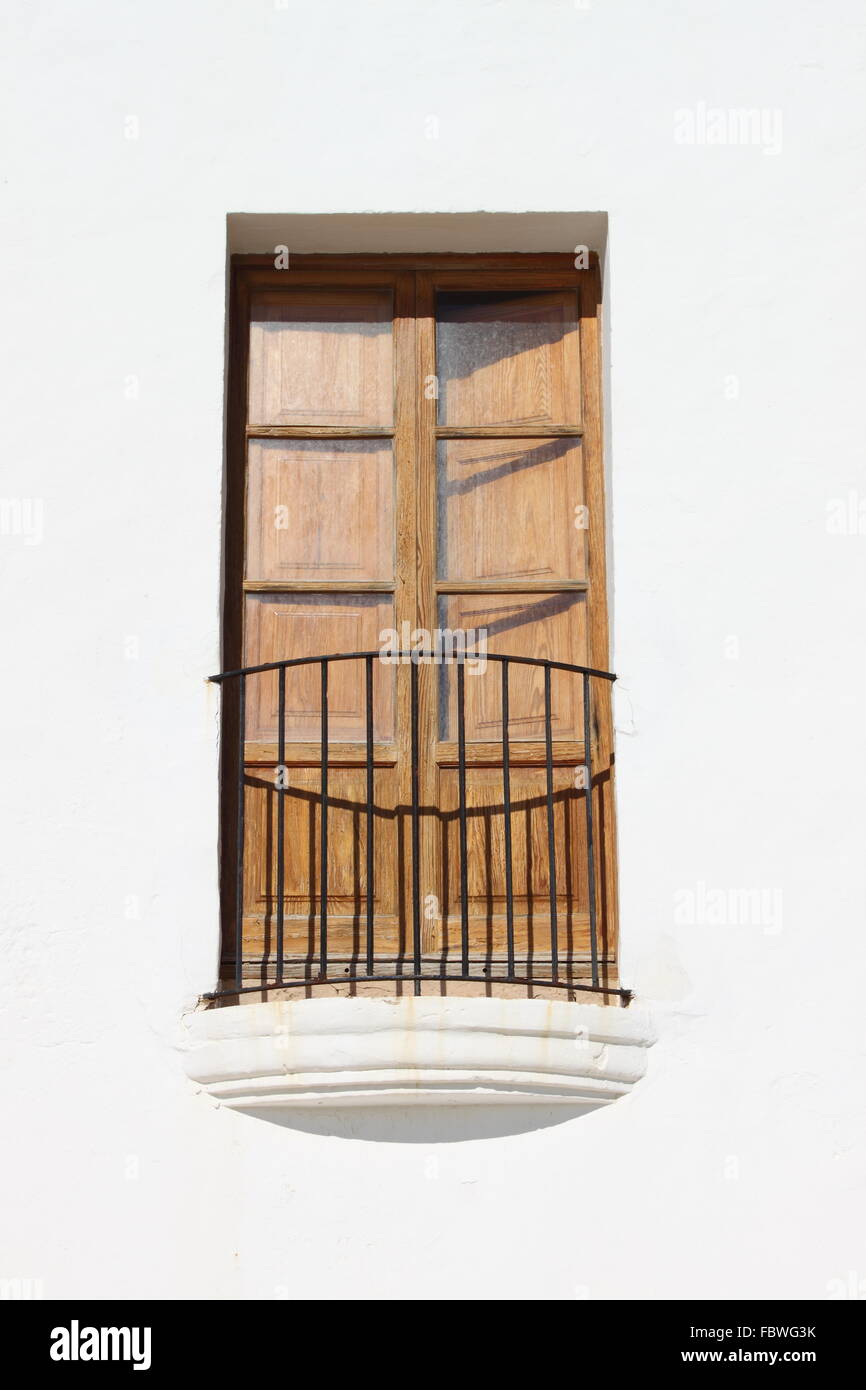 Typical white house with colored window in Ibiza island, Spain Stock Photo