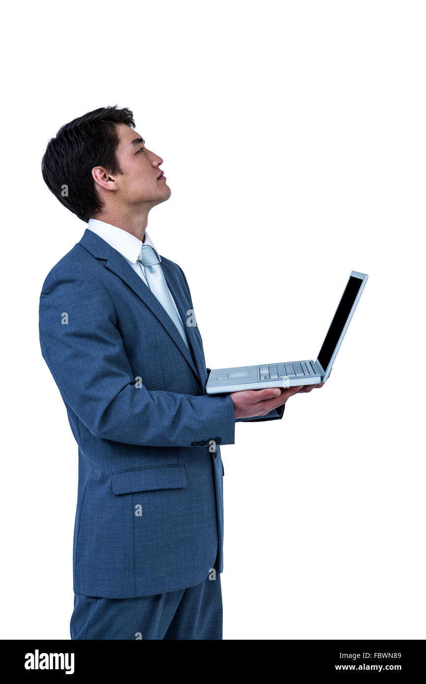 Businessman look away with his computer Stock Photo