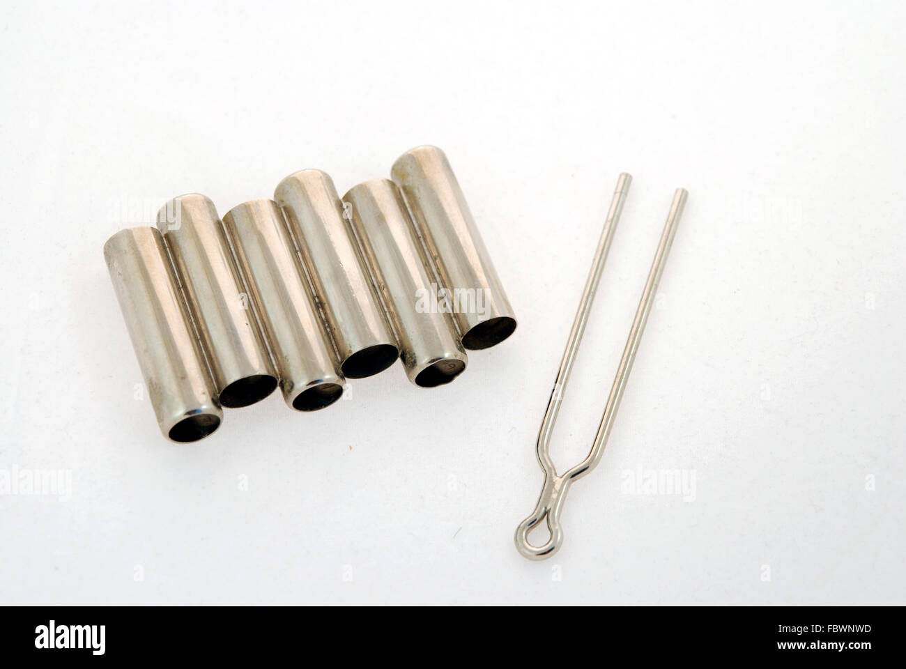 Tuning fork and pipe for guitar Stock Photo