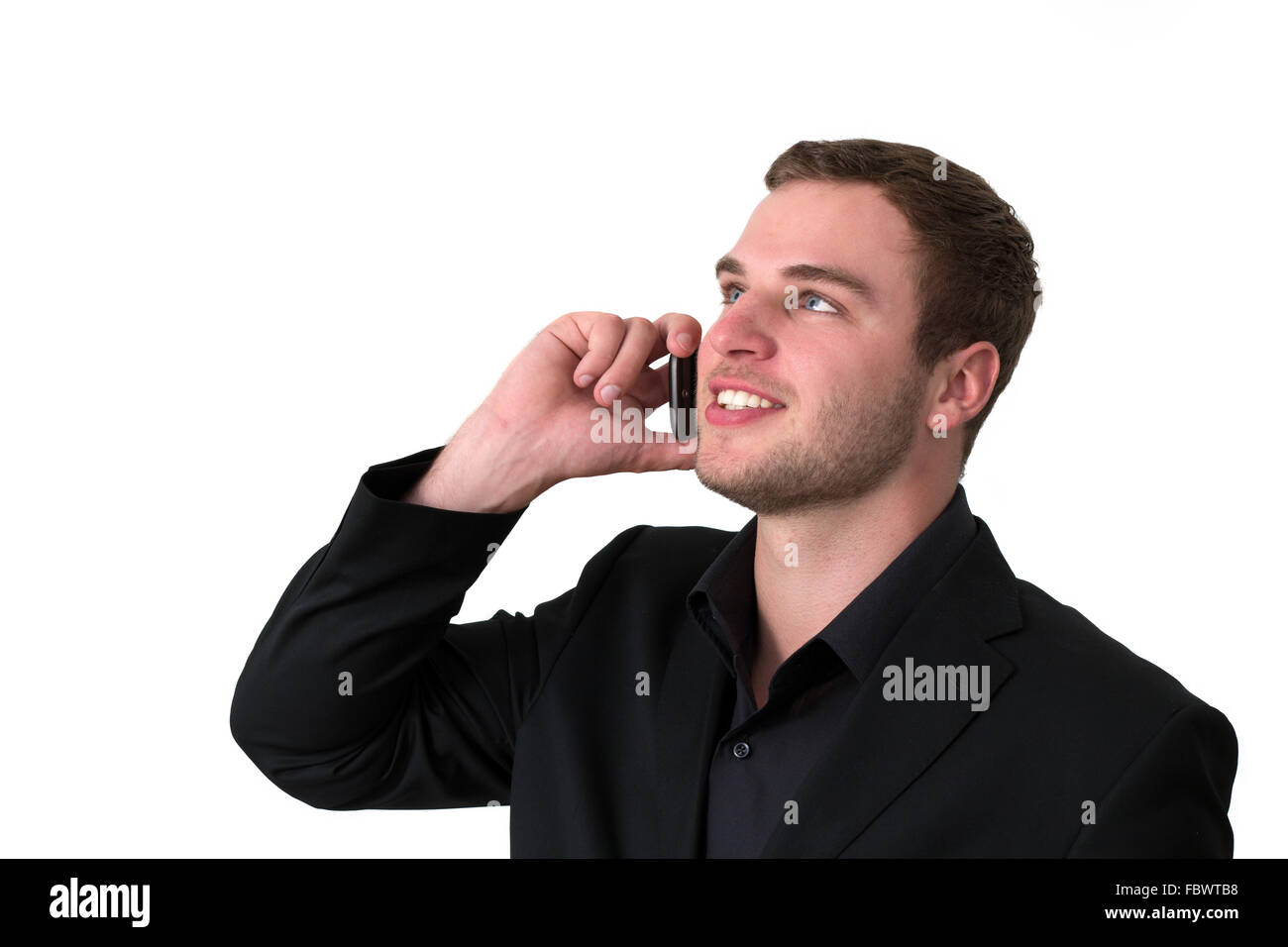 Young Man in jacket talking on the phone Stock Photo