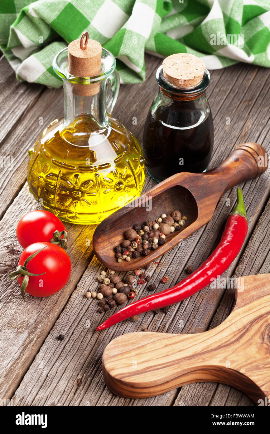 Spices and condiments on wooden table Stock Photo