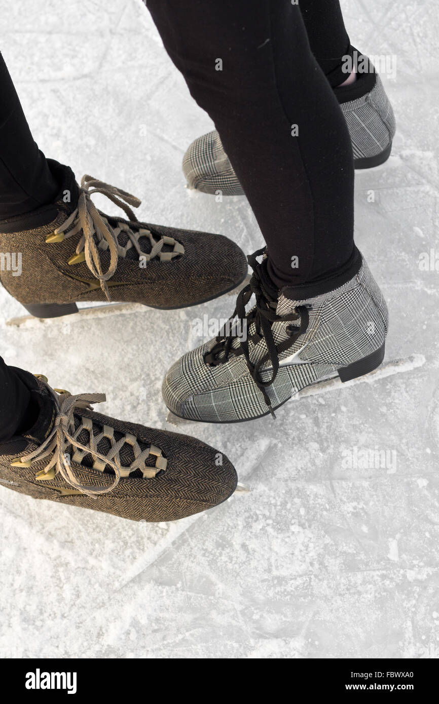 Brown And Grey Ice Skating Boots On Ice Stock Photo