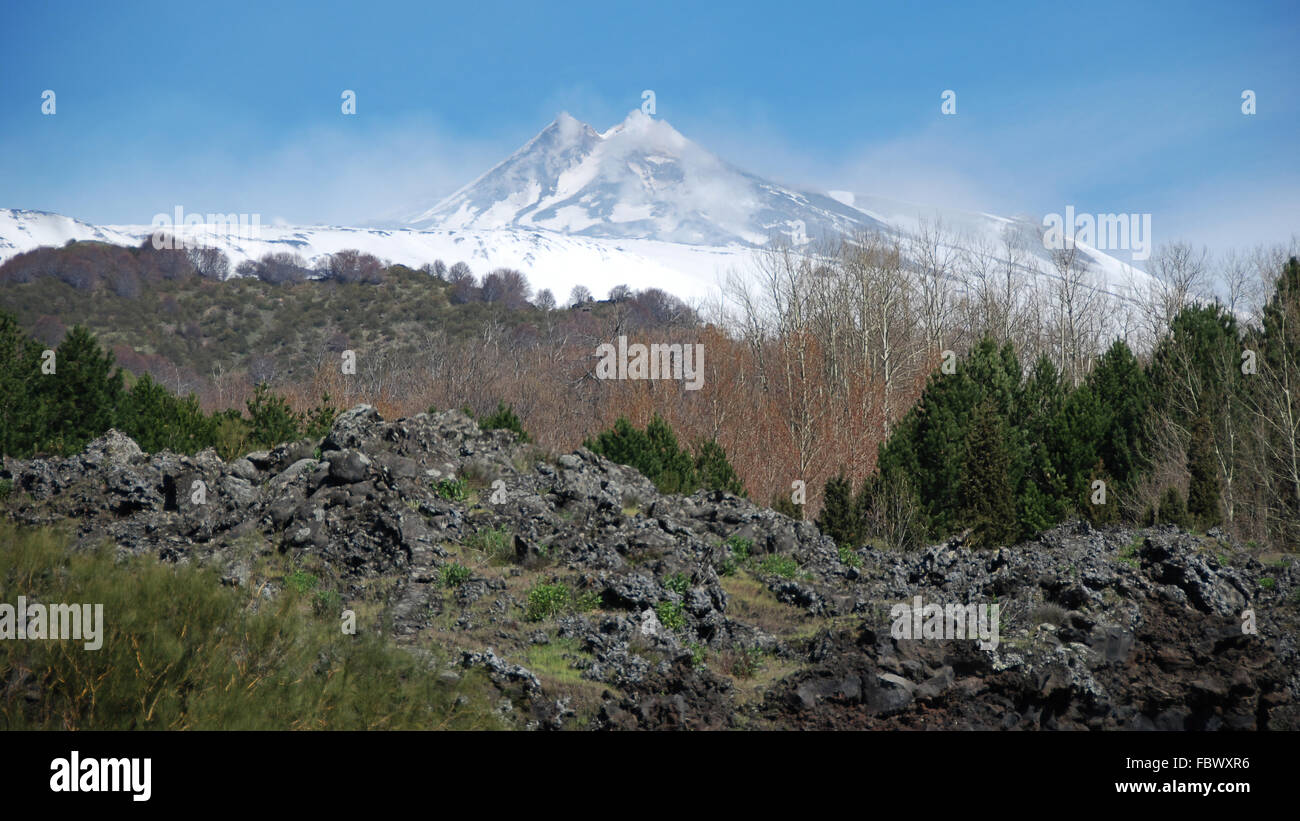 Snowcovered Mount Etna in spring Stock Photo