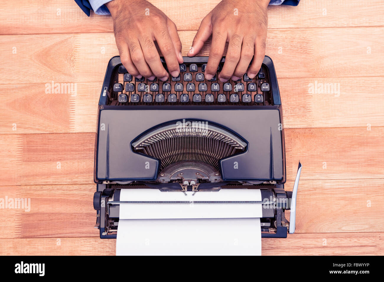 High angle view of businessman typing on typewriter Stock Photo