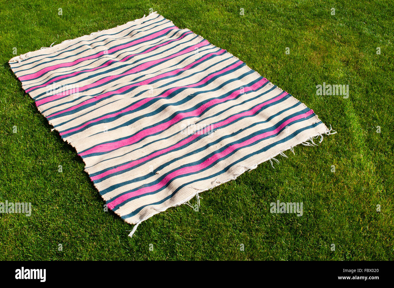 colorful picnic blanket on the grass field Stock Photo - Alamy