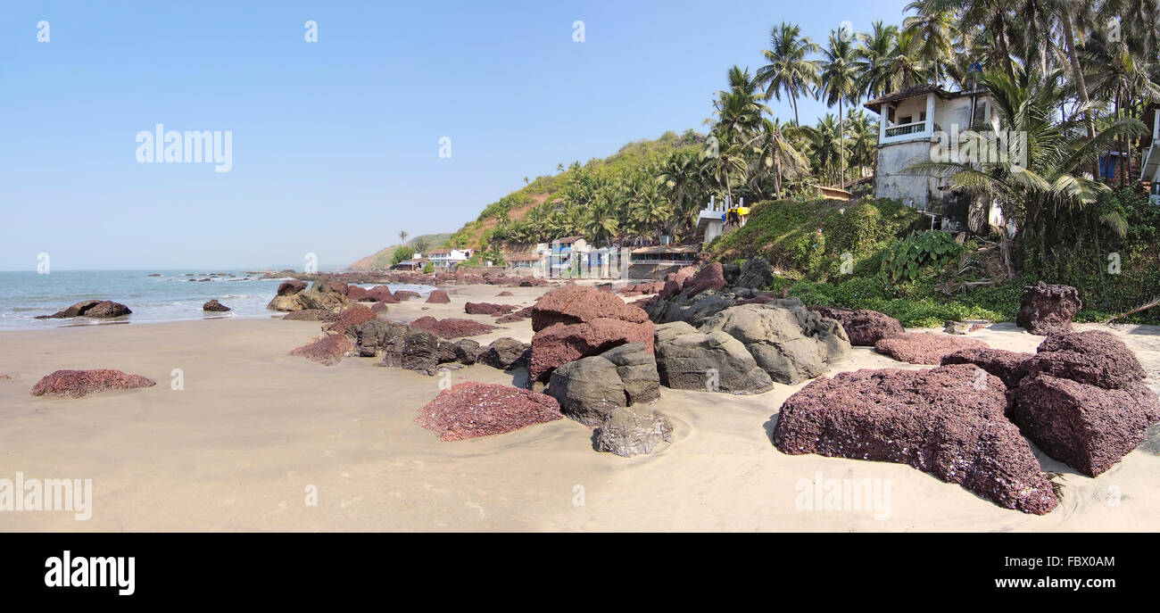 deserted beach with huts in Goa, India Stock Photo