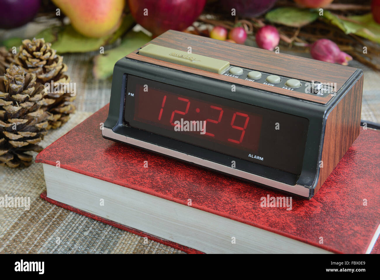 old digital alarm clock, grunge and old condition, wood paint Stock Photo