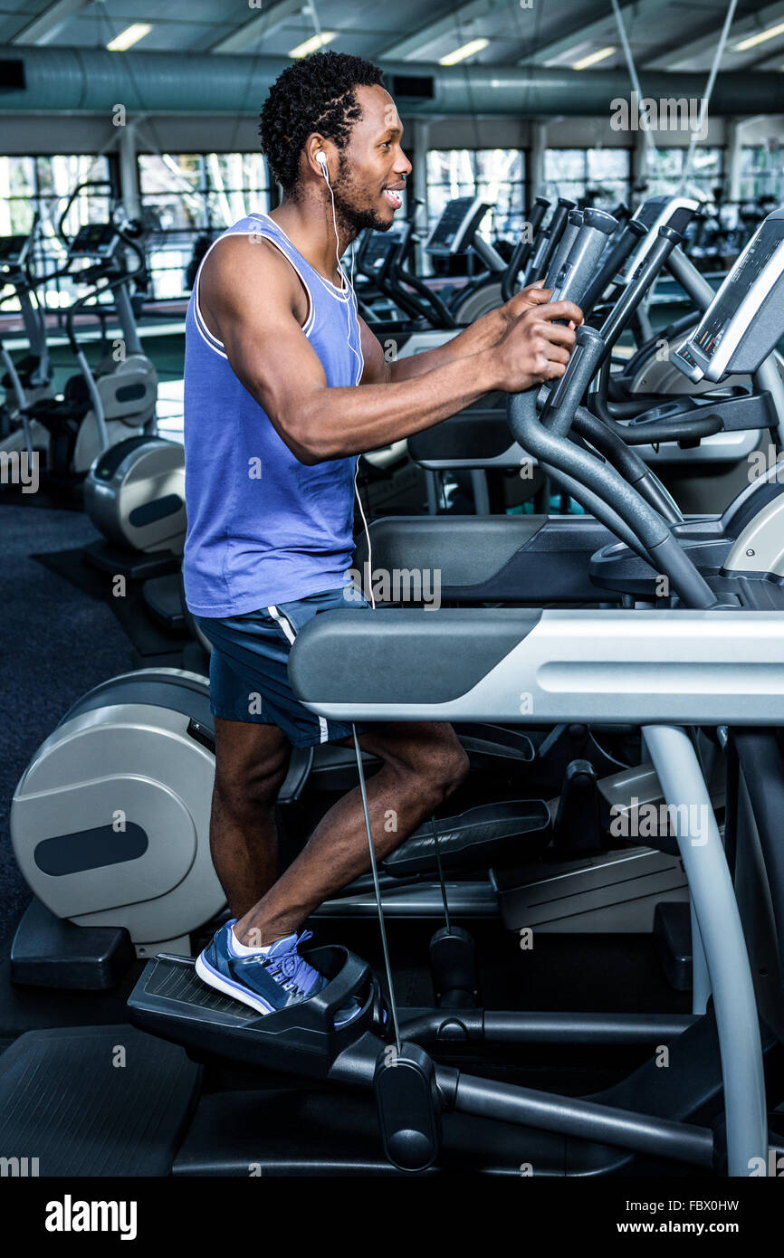 Smiling man working out with headphones on Stock Photo